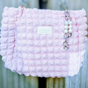 Pink Textured Clutch with Pearl Accent